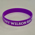Purple Tony Wilson Racing silicone wristband with white lettering and checkered flags